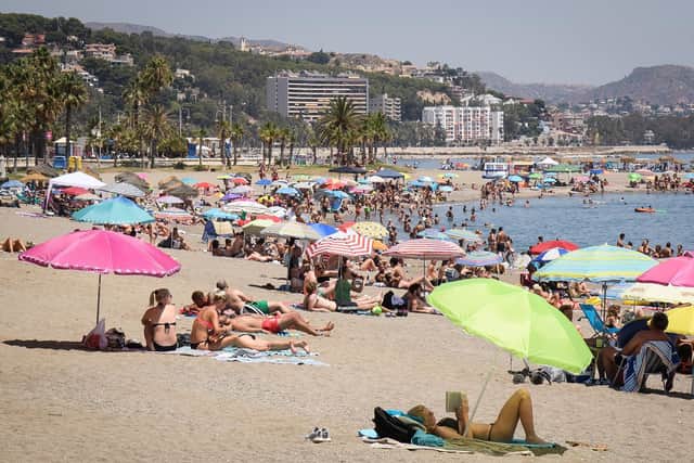 MALAGA, SPAIN - JULY 23:  People enjoy the summer sun on the beach on July 23, 2017 in Malaga, Spain. . (Photo by Leon Neal/Getty Images)