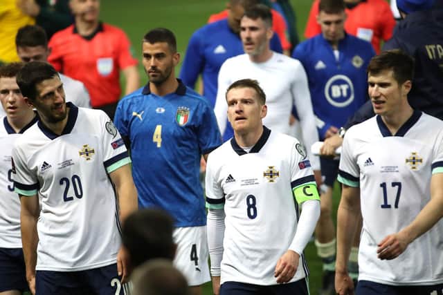 Northern Ireland players pictured after the defeat to Italy