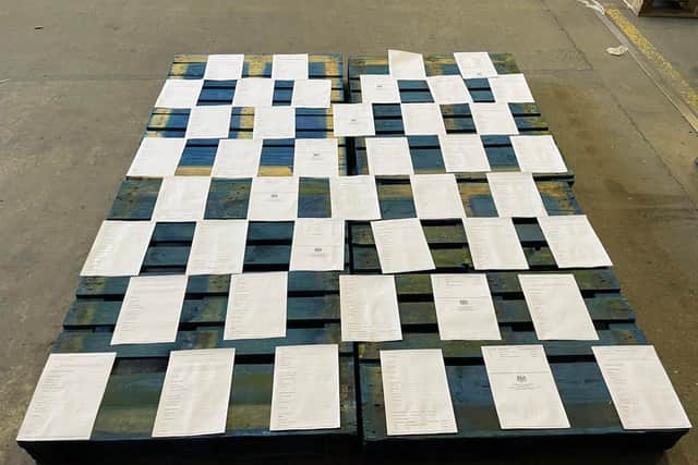 The paperwork required to buy four pallets of jam, marmalade and chutney from England, laid out on top of the four pallets