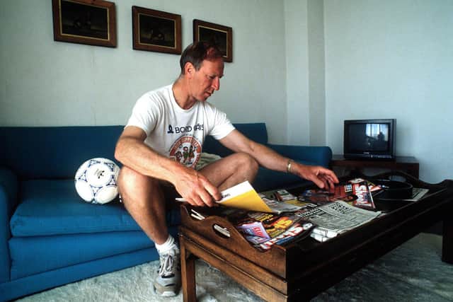 Jack as Ireland manager, looking over football magazines during the 1990 World Cup