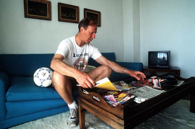 Jack as Ireland manager, looking over football magazines during the 1990 World Cup