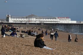 People on Brighton beach ahead of the expected warm weather.