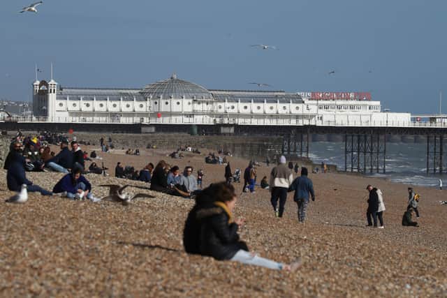 People on Brighton beach ahead of the expected warm weather.