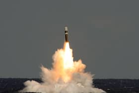 An unarmed Trident II (D5) ballistic missile, during a UK test launch in the Atlantic in 2012. In 2010 the government planned to cut its nuclear warhead stockpile from 225 to 180, the maximum figure is now to increase to 260: Photo: PO(Phot) Lockheed Martin/ MoD Crown Copyright/PA Wire
