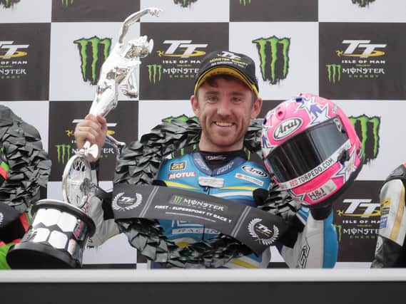 Lee Johnston celebrates his Supersport win at the Isle of Man TT in 2019.