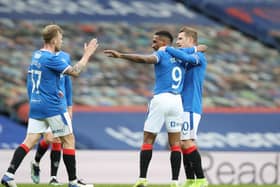 Rangers Jermain Defoe celebrates with teammates Scott Arfield and Steven Davis after scoring their team’s first goal