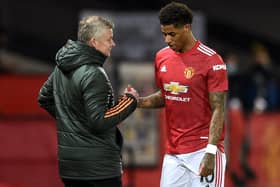 Manchester United's Marcus Rashford (right) with manager Ole Gunnar Solskjaer. Pic by PA.