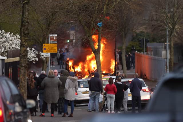 A bus is hijacked and set on fire during rioting on the Shankill road this evening.