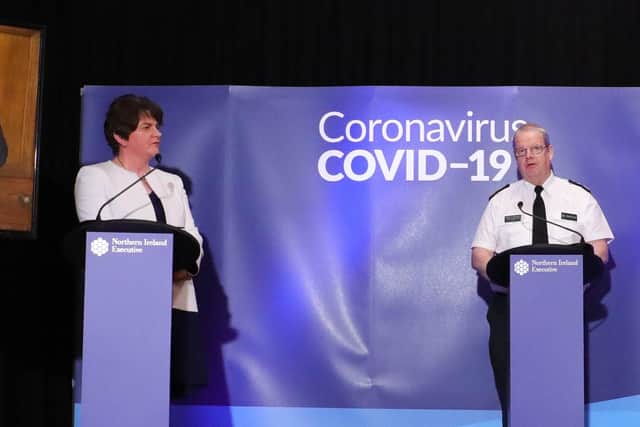 The first minister Arlene Foster at a Covid press conference alongside the chief constable Simon Byrne at a Covid press conference last year