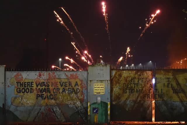 Groups on both sides of the Peace Wall near Lanark Way hurled missiles at one another.