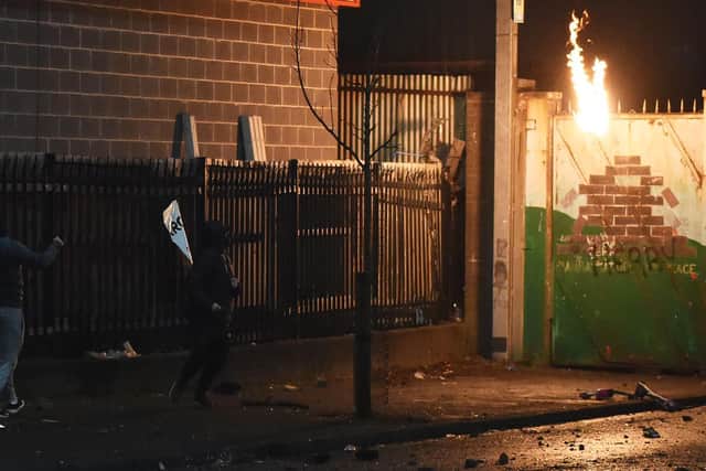 Youths throwing missiles near Lanark Way in Belfast.