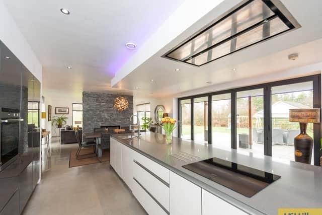 Kitchen with high gloss units and Quartz worksurfaces with built-in appliances