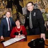Junior Minister Gordon Lyons MLA with Mayor of Mid and East Antrim, Cllr Maureen Morrow, and Alister Bell, manager of The Gobbins.