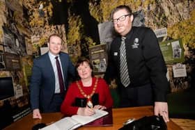 Junior Minister Gordon Lyons MLA with Mayor of Mid and East Antrim, Cllr Maureen Morrow, and Alister Bell, manager of The Gobbins.