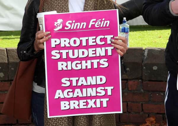 A Sinn Fein placard held by a student at Queen's University Belfast; unionist students have complained that there is a dominant republican ethos among students at the institution