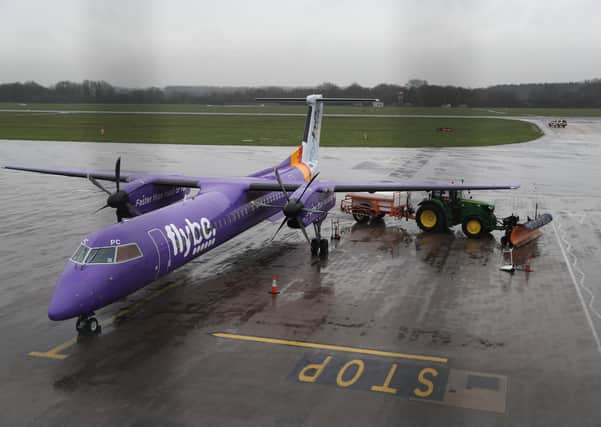A tractor blocks the wing of a Flybe plane at Southampton Airport as Flybe, Europe's biggest regional airline, has collapsed into administration