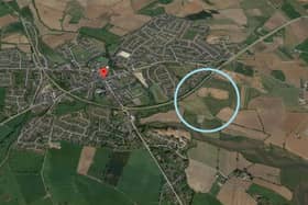 GoogleMaps aerial image of Comber, with the development site circled