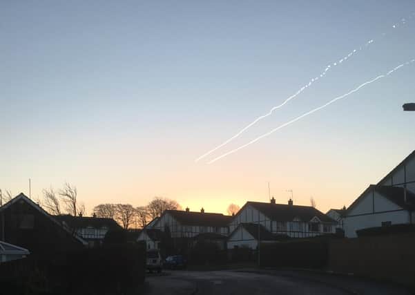 Two planes racing high in the sky
