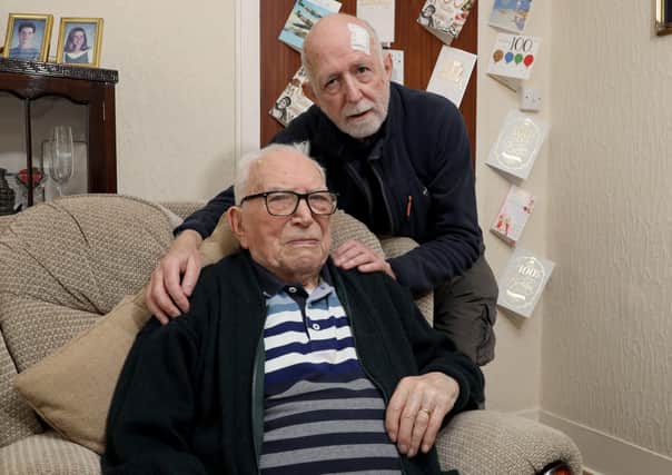 Teddy Dixon and his son Johnston at Teddy's home in East Belfast.
Photo Laura Davison/Pacemaker Press