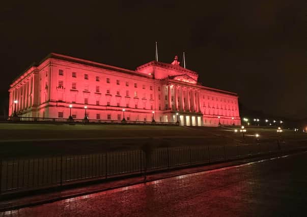 Stormont is illuminated last March, in 2019, to mark 
European Remembrance Day for Victims of Terrorism. Photo: David McCormick/Pacemaker Press