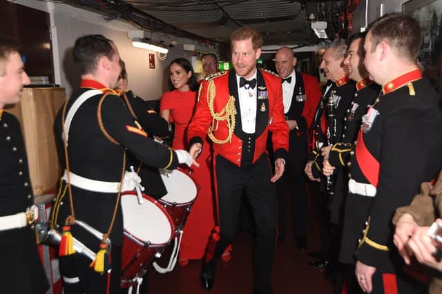 The Duke and Duchess of Sussex meet the Massed Bands of Her Majesty's Royal Marines at The Mountbatten Festival of Music at the Royal Albert Hall in London