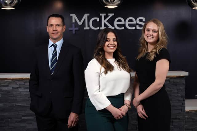Joining Managing Partner, Chris Ross (third left) at the announcement are two of McKees Trainee Solicitors, Lillie Turkington and Victoria Graves