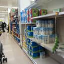 Shelves in Tesco, Belfast city centre, were running low on toilet rolls on Wednesday afternoon, and customers were being advised not to buy more than five of any one item