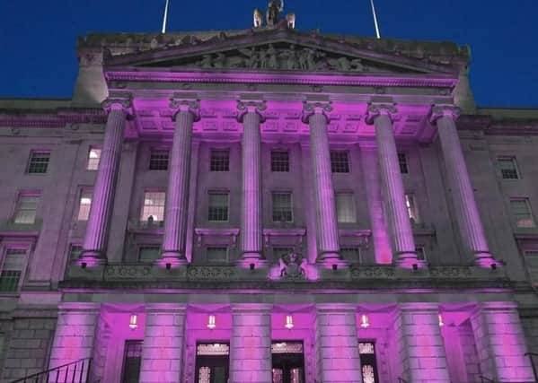 Stormont is illuminated for International Women's Day on Sunday March 8 2020. Unionists including Jim Allister MLA asked why it is not being lit up for European Victims of Terrorism Day. Image taken from @niassembly twitter feed, which put it out with the following wording: 'Parliament Buildings is going purple tonight to mark #InternationalWomensDay2020 
#EachForEqual'