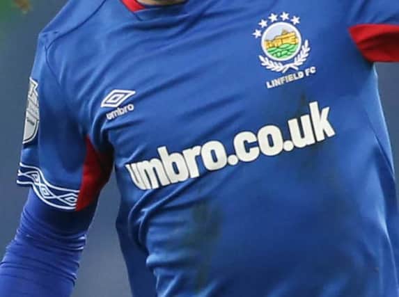 Linfield have confirmed one of their players has tested positive for coronavirus