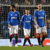 Rangers Scott Arfield (centre) reacts after Bayer Leverkusen's Leon Baily (not pictured) scores his side's third goal of the game during the UEFA Europa League round of 16 first leg match at Ibrox Stadium, Glasgow.