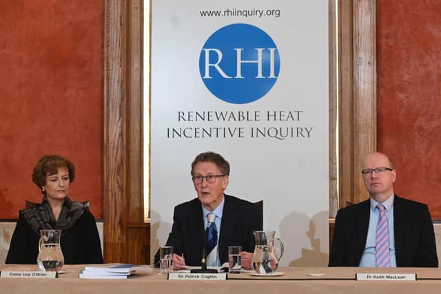 Sir Patrick Coghlin (centre) at the launch of his report at Stormont on Friday
