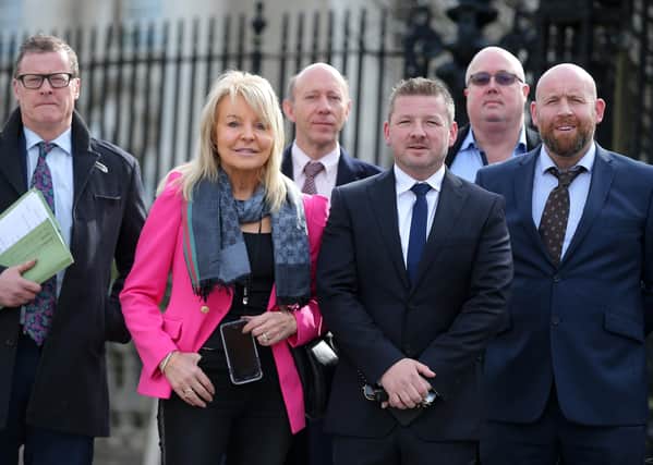 Chris Gordon (second right, front) with supporters and members of his legal team at the High Court in Belfast