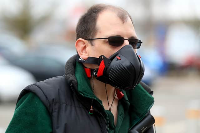 A man is seen wearing a protective face mask in the UK. (Photo: PA Wire)
