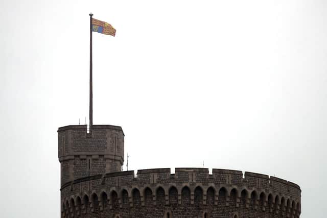 The Royal Standard flag flying over Windsor Castle as Queen Elizabeth II arrives at Windsor Castle, from Buckingham Palace in London to socially distance herself amid the coronavirus pandemic