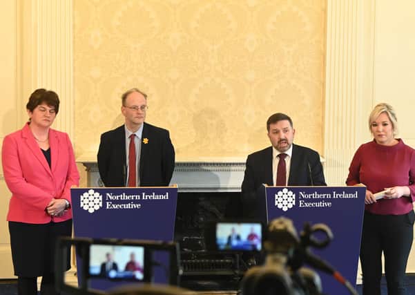 Robin Swann addressing the public at Stormont Castle on Thursday, flanked by the First Minister, deputy First Minister and Education Minister