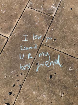 Messages of hope scrawled on the ground