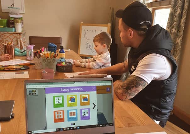Carl Frampton at 'home school' with son Rossa