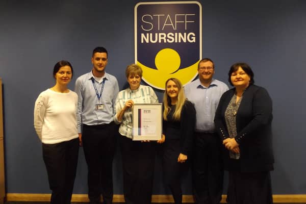 Staff Nursing emplyees celebrate their award