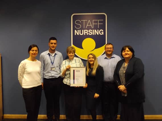 Staff Nursing emplyees celebrate their award