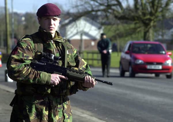 13/3/2001:  A paratrooper assists the RUC at a checkpoint in Dungannon, Co Tyrone set up around the foot-and-mouth exclusion zone following a disease scare in a local meat plant
