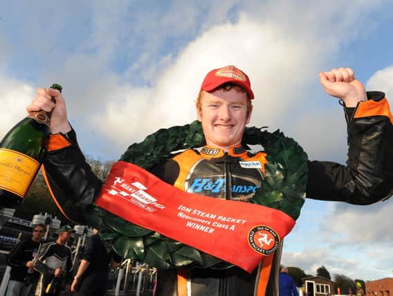Portadown man Wayne Hamilton celebrates his debut victory in the Newcomers race at the Manx Grand Prix in 2011. Picture: Pacemaker Press.