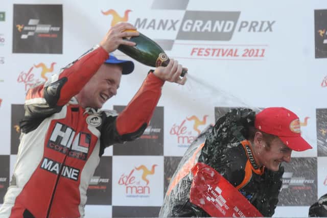 MGP Newcomers race winner Wayne Hamilton gets sprayed with the victory champagne by fellow Northern Ireland man and runner-up William Davison in 2011. Picture: Pacemaker Press.