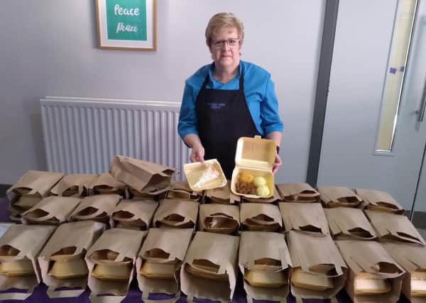 Barbara Haughan of the Movilla Abbey Church catering team helps put together dinners for the vulnerable as part of the Ards Churches Response.