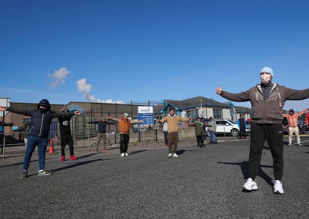 Meat factory workers outside the Linden Foods factory in Dungannon. Photo: Kelvin Boyes / Press Eye.