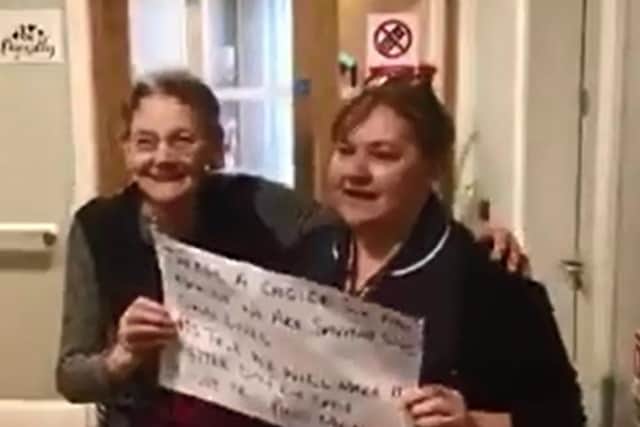 One the residents and a staff member singing 'We Are The World' in the video. (Video courtesy of Corriewood Private Clinic)