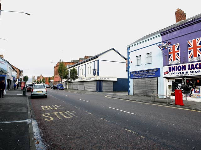 The economic costs of a deep recession could lead to a rise in the number of disadvantaged people dying in places such as Lower Newtownards Road in east Belfast, above, or the Falls Road in west Belfast