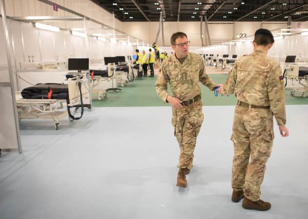Soldiers setting up an NHS Nightingale hospital in London. Yet there is no suggestion of such a hospital in Northern Ireland. Photo: Stefan Rousseau/PA Wire