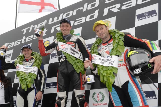 Podium celebrations for race winner Dan Kneen, runner-up Dean Harrison (left) and Bruce Anstey after the 2014 Superstock race at the Ulster Grand Prix.