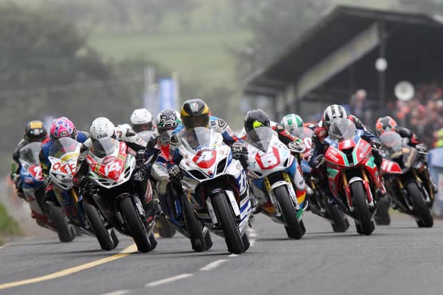 Guy Martin (4) leads the Superstock race away at the 2014 Ulster Grand Prix from Dan Kneen (14), Dean Harrison (partially obscured), Bruce Anstey (5), Lee Johnston (13) and Michael Dunlop (1).