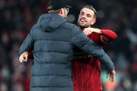 Liverpool captain Jordan Henderson with manager Jurgen Klopp. Pic by PA.